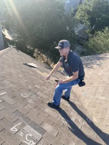 roofing contractor inspecting the roof